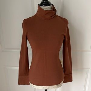 Etcetera brown long sleeve sweater w/satin coordinating color trim at collar.